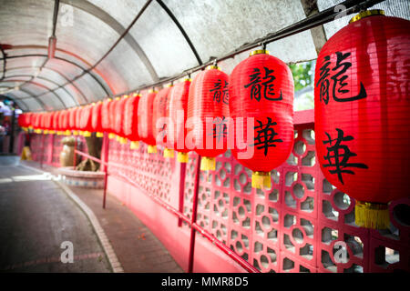 The Lung Wah Hotel in Shatin, Wo Che, Hong Kong is a restaurant is famous for roasted pigeon and their long corridor is decorated with red lanterns. Stock Photo
