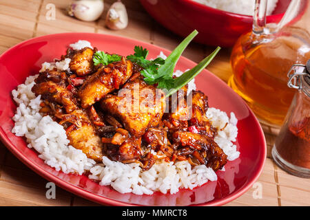 Chinese sticky pork sirloin roasted with a sweet and savory sauce served with boiled rice Stock Photo