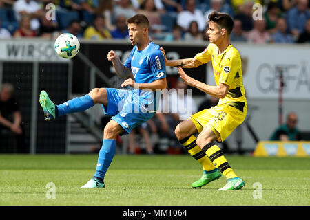 Sinsheim, Germany. 12th May, 2018. Andrej Kramaric (L) of Hoffenheim vies with Julian Weigl of Dortmund during the Bundesliga match between TSG 1899 Hoffenheim and Borussia Dortmund at Wirsol Rhein-Neckar Arena in Sinsheim, Germany, on May 12, 2018. Hoffenheim won 3-1. Credit: Joachim Bywaletz/Xinhua/Alamy Live News Stock Photo