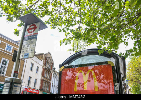 London UK. 13th May 2018. A McDonalds cheap meal advertised on a bus stop in Wimbledon. London Mayor Sadiq Khan has drawn up  plans to ban junk food advertsing on TFL London Underground and Buses  in order to reduce the growing problem  of childhood obesity Credit: amer ghazzal/Alamy Live News Stock Photo