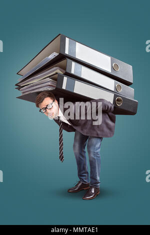Man carrying a giant stack of folders Stock Photo