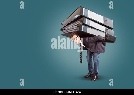 Man carrying a giant stack of folders Stock Photo