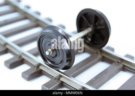 Train toy wheels. Train model wheels. Train wagon miniature model wheels. Train wheels on a railway. Stock Photo