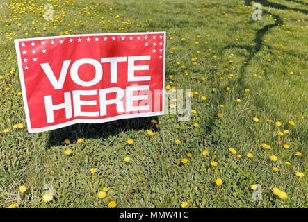 'Vote Here' signs placed in grass outside polling station in Willowick, Ohio, USA for the May 2018 primary elections. Stock Photo