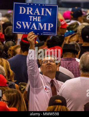 AUGUST 22, 2017, PHOENIX, AZ   Man holds sign 'Drain the Swamp' during President Trump Holds Rally In Phoenix, Arizona -  Phoenix Convention Center Stock Photo