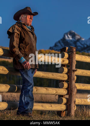 OCT 4, 2017, RIDGWAY COLORADO - Cowboy, Howard Linscott looks out over historic Last Dollar Ranch on Hastings Mesa, SW Colorado, San Juan Mountains Stock Photo