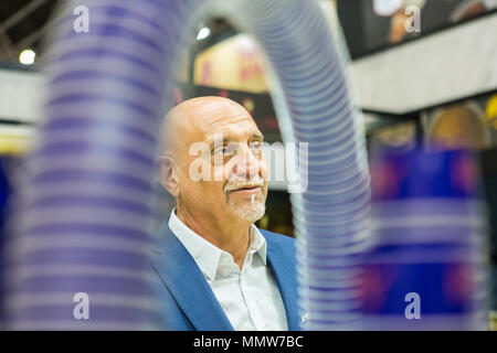 A bald head middle aged business man in a food exhibiton event in Singapore. Stock Photo