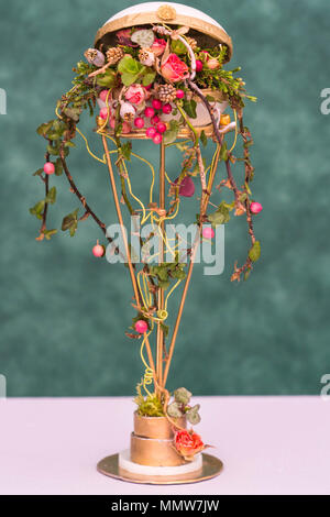 Decorative display using Rose buds, Ivy and berries. Malvern Spring Festival Worcestershire UK. May 2018
