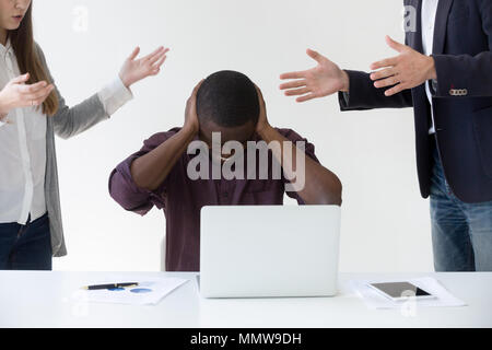 Angry overwhelmed african businessman frustrated with discrimina Stock Photo