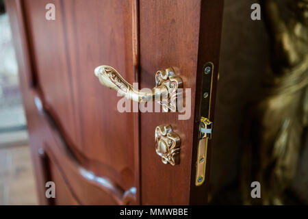 Part of the door. Antique luxury door knob. Elegant handle Stock Photo