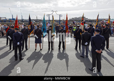 Standard bearers of the Royal British Legion, regiments & island groups at the Guernsey Liberation Day parade Stock Photo