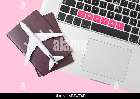 passport , white plane model and computer laptop on white background . travel , visa and vacation concept Stock Photo