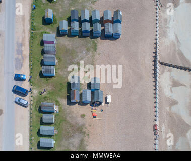 aerial views along the coast of hayling island and the beach huts in hampshire by drone Stock Photo