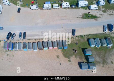 aerial views along the coast of hayling island and the beach huts in hampshire by drone Stock Photo