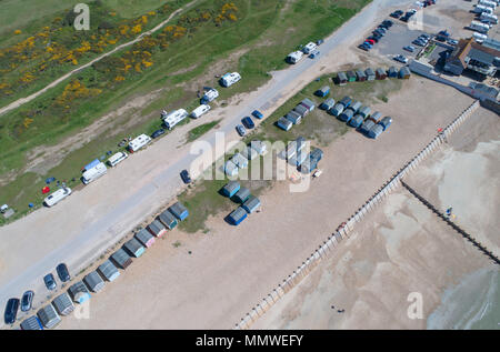 aerial views along the coast of hayling island and the beach huts in hampshire by drone Stock Photo