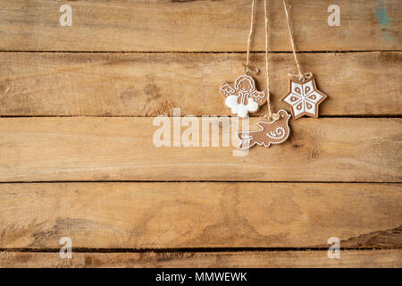 christmas decoration hanging on wood background with space. Stock Photo