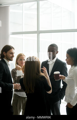 Executive business team having discussion at coffee break in off Stock Photo