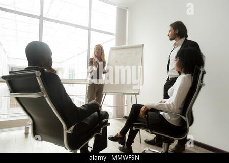 African business team listening to speakers giving presentation  Stock Photo