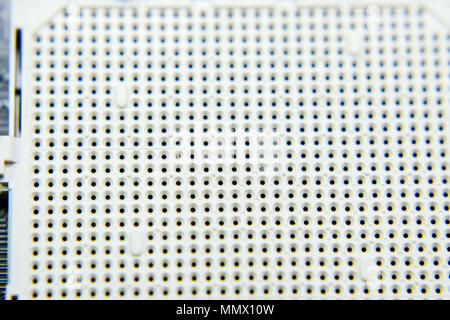A socket under the processor of the computer, holes under the feet of ...