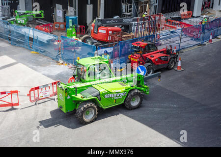 Construction vehicles and crane on a building site in London, UK Stock Photo
