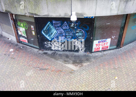 Shuttered up shop units in a walkway in Birmingham city centre, West Midlands, UK Stock Photo