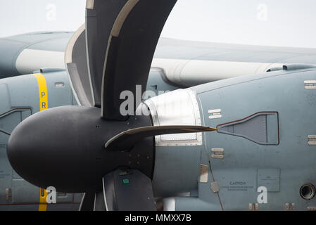 Propeller and engine detail of four engine turboprop military cargo airplane with 8-blade propellers. Stock Photo