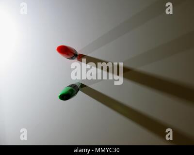 Highlighters casting shadows on white background. Stock Photo