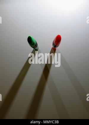 Highlighters casting shadows on white background. Stock Photo