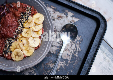 Delicious breakfast bowl and spoon on a serving tray Stock Photo