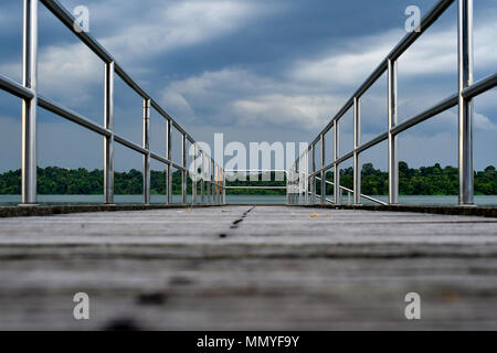 wooden bridge perspective storm cloud Stock Photo