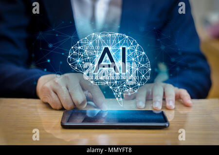 AI Hand Business people press the phone. Brain Graphic Binary Blue Technology Stock Photo