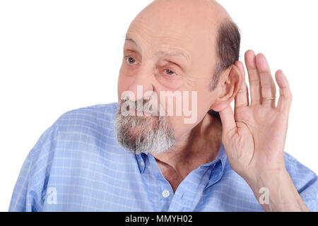 Portrait of deaf old man trying to listen. Isolated in a white background Stock Photo