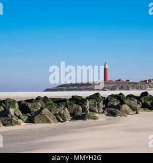 Old lighthouse on the beach of De Cocksdorp, The Netherlands. Stock Photo