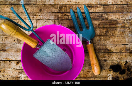 Gardening tools on a wooden table top view Stock Photo