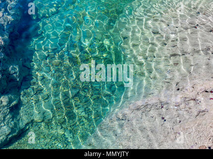 a detail image of one of st barts natural tidal pools in the anse toiny  area with black spiny sea urchins Stock Photo