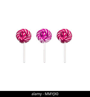 Lollipops Flat lay Minimal concept Three classic round lollipops are lying in a row on white background Trendy photo mockup for banner, poster, web Stock Photo