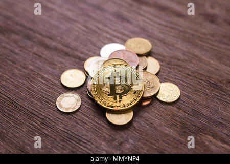 Bitcoin on coins of different countries . Digital payment system. Digital coin crypto money on bitcoin farm in digital cyberspace Stock Photo