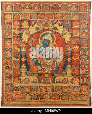 .  English: Acala, The Buddhist Protector. Nepal, Kathmandu Valley, early Malla period. Distemper and gold on cloth, 32 x 26 1/2 in. (81.3 x 67.3 cm). Acala (literally, “immovable”) is a wrathful manifestation of Manjushri. He wields a sword to dispatch ignorance and a noose to snare disbelievers. His enflamed wide eyes and a facial grimace exposing teeth express his fearsome aspect. He kneels with one knee on the ground, evoking his role as a protector of the earth. He is set in a flaming aureole, his knowledge field, and is honored with an elaborate archway (torana) topped by Garuda fighting Stock Photo