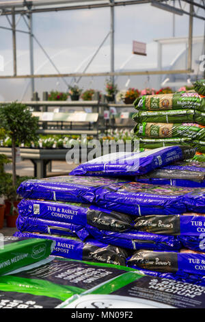 Stacks of compost bags for sale at a Garden Nursery Stock Photo