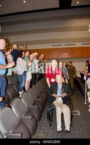 Members of the 30th Infantry Division Association gathered at the North Carolina National Guard’s Joint Force Headquarters in Raleigh, North Carolina as part of their 71st Reunion, August 5, 2017.    WWII Veterans who had served with the 30th were greeted by a walkway lined with Soldiers rendering salutes and cheering Soldiers as they entered the building.     The reunion participants made their way to the headquarters to watch a screening of Heroes of Old Hickory, a documentary that tells the story of the 30th Infantry Division in WWII.    (U.S. Army National Guard photo by Sgt. Odaliska Almo Stock Photo