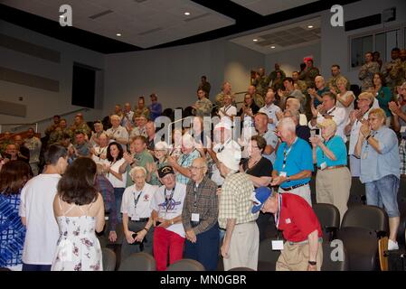 Members of the 30th Infantry Division Association gathered at the North Carolina National Guard’s Joint Force Headquarters in Raleigh, North Carolina as part of their 71st Reunion, August 5, 2017.    WWII Veterans who had served with the 30th were greeted by a walkway lined with Soldiers rendering salutes and cheering Soldiers as they entered the building.     The reunion participants made their way to the headquarters to watch a screening of Heroes of Old Hickory, a documentary that tells the story of the 30th Infantry Division in WWII.    (U.S. Army National Guard photo by Sgt. Odaliska Almo Stock Photo