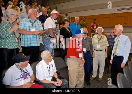 Members of the 30th Infantry Division Association gathered at the North Carolina National Guard’s Joint Force Headquarters in Raleigh, North Carolina as part of their 71st Reunion, August 5, 2017.    WWII Veterans who had served with the 30th were greeted by a walkway lined with Soldiers rendering salutes and cheering Soldiers as they entered the building.     The reunion participants made their way to the headquarters to watch a screening of Heroes of Old Hickory, a documentary that tells the story of the 30th Infantry Division in WWII.    After watching the premiere of “Heroes of Old Hickory Stock Photo