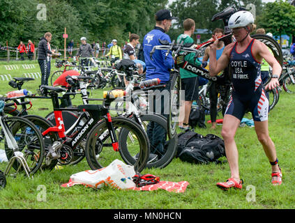 U.S. Air Force Maj. Judy Coyle finishes the swim portion and prepares for the cycling portion of the World Military Triathlon Championship Aug. 5, 2017, in Sassendorf, Germany. Maj. Coyle competed with 15 service members from the United States against military members from 22 countries worldwide. The Armed Forces team won second place overall. (U.S. Marine Corps photo by Lance Cpl. Savannah Mosby/Released) Stock Photo