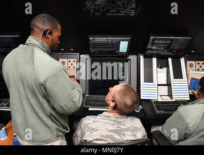 Air traffic controllers works in a portable control tower during ...