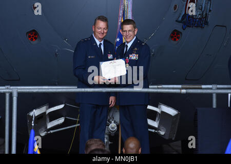 Col. Howard Wagner, the former commander of the 105th Airlift Wing, is presented the Legion of Merit during a change of command ceremony at Stewart Air National Guard Base, Newburgh, New York Aug. 6, 2017. The medal is awarded to those who distinguished themselves by exceptionally meritorious conduct in the performance of outstanding service. Stock Photo