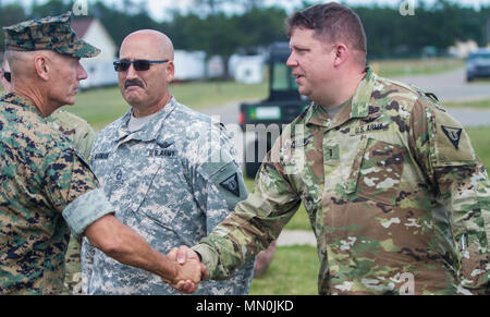 Lt. Gen. Rex McMillian, Commanding Officer of Marine Corps Forces Reserve and Marine Forces North shakes hands with CW3 Lee Fuller the Grayling Army Airfield Aviation Safety Officer. McMillian arrived at the airfield on Aug. 7, 2017 to oversee the Marines participating in exercise Northern Strike 17. Northern Strike 17 is a National Guard Bureau-sponsored exercise uniting approximately 5,000 service members from 13 states and five coalition countries during the first two weeks of August 2017 at the Camp Grayling Joint Maneuver Training Center and the Alpena Combat Readiness Training Center, bo Stock Photo