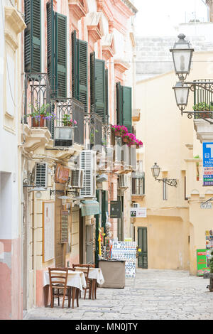 Gallipoli, Apulia, Italy - MAY 2017 - Traditional facades in the pedestrian area of Gallipoli Stock Photo