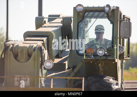 Soldiers with the 38th Sustainment Brigade set up rail car spanners at the Camp Atterbury railhead in preparation for the 76th Infantry Brigade Combat Team’s return from the Joint Readiness Training Center in Fort Polk, La. on August 9, 2017. (U.S. Army Photo by Staff Sgt. Jeremiah Runser) Stock Photo