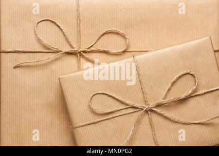 Close up of two gift boxes wrapped in brown recycled paper Stock Photo