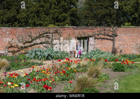 A sunny and warm Spring day in the gardens of the stately home Kelmarsh Hall; Northamptonshire, England, UK Stock Photo